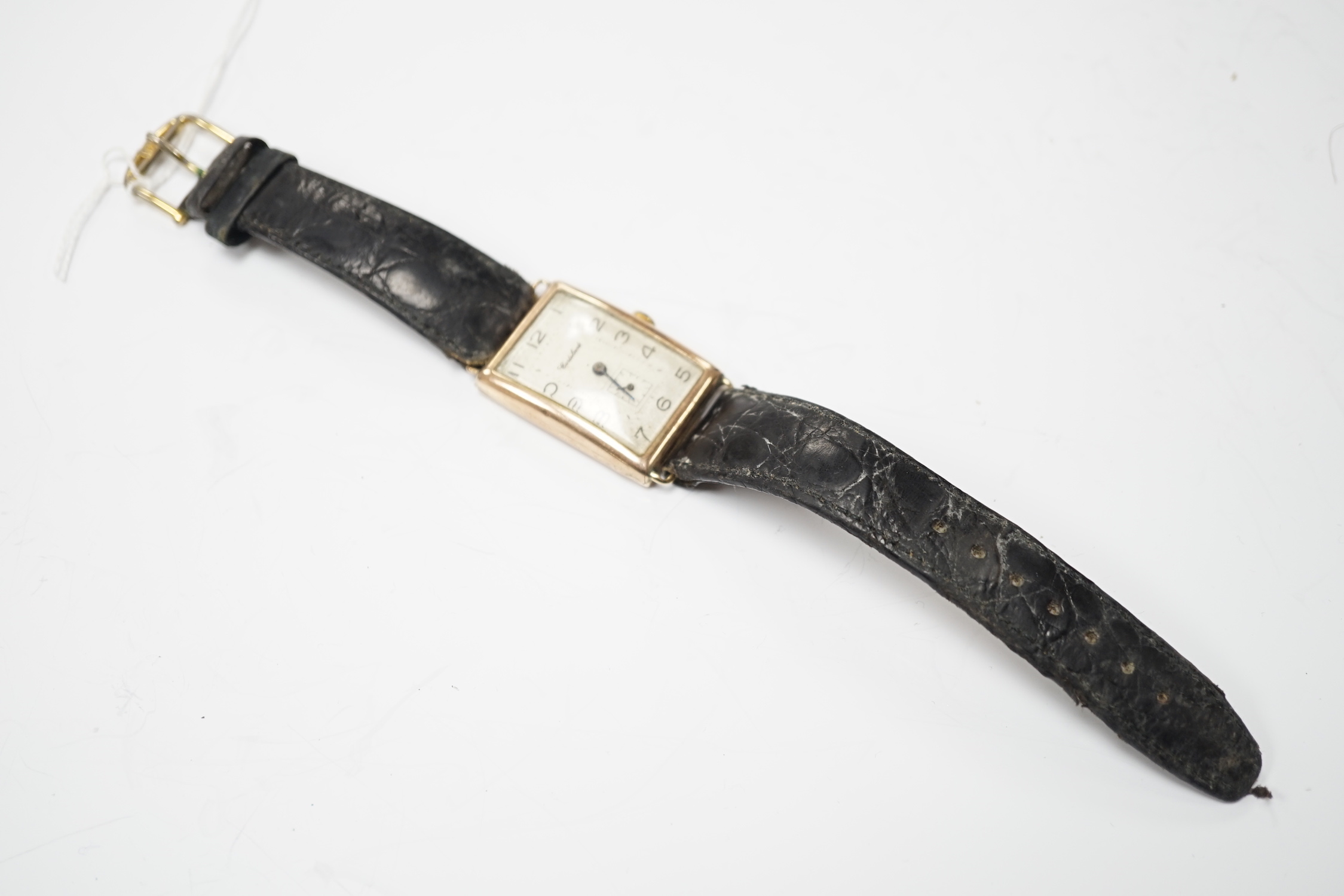 A gentleman's 1930's 9ct gold Cortebert manual wind rectangular dial wrist watch, on a leather strap.